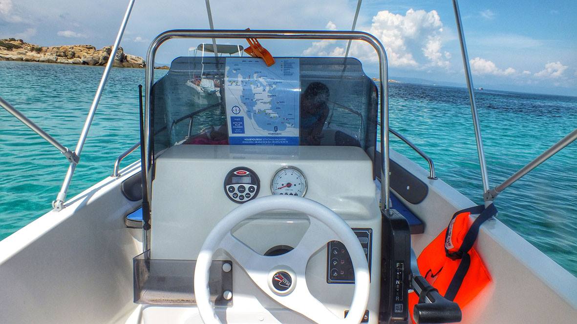 Boat deck on turquoise water Diaporos island Halkidiki